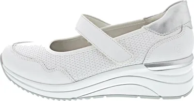 A side view of a white women's shoe with silver accents.