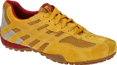 A single yellow sneaker is shown against a white background.