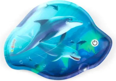 A close-up, angled view of a blue, fish-shaped water-filled play mat with dolphins depicted on it.
