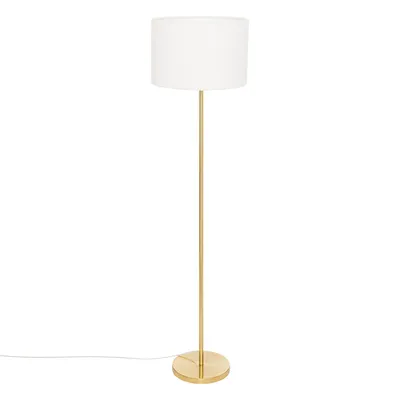 A floor lamp with a gold base and stem, and a white cylindrical lampshade, isolated on a white background.