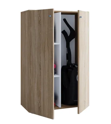 A wooden cabinet with two doors, partially open, revealing shelves and a black vacuum cleaner inside.