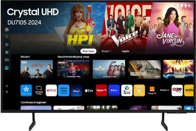A Samsung Crystal UHD TV displaying a smart TV interface with various streaming service logos and program previews.