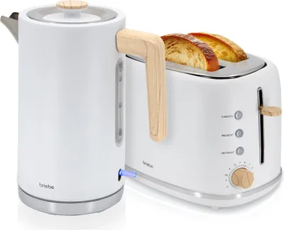 A white electric kettle and a white toaster with bread inside, both featuring wood accents, are displayed against a white background.