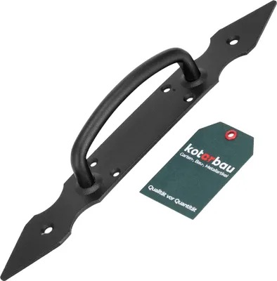 A black metal door handle with a decorative plate and a green tag.