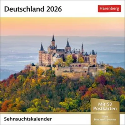 A majestic castle sits atop a hill covered in colorful autumn foliage, with a hazy mountain landscape in the background.
