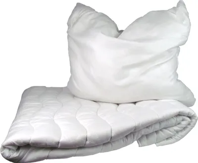 A white pillow and a white quilted blanket are shown on a white background.