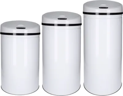 Three white trash cans of different sizes are lined up against a white background.