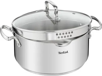 A stainless steel pot with a glass lid and a steamer insert.