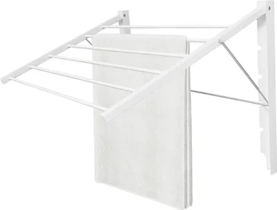 A white wall-mounted retractable clothes drying rack with white towels hanging on it, against a white background.
