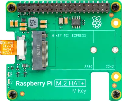 A top-down view of a green circuit board with electronic components and text.