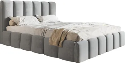 A light gray upholstered bed with a tufted headboard and footboard, shown against a white background.