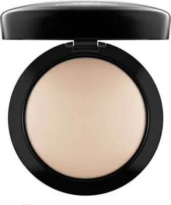 A close-up, front-facing shot of a MAC Mineralize Skinfinish Natural compact powder.