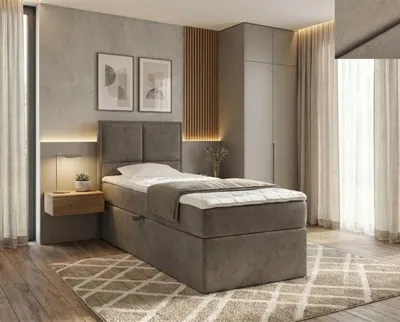 A bedroom setting with a bed, nightstand, and wardrobe.