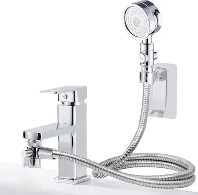 A chrome faucet with a detachable shower head and hose attached.