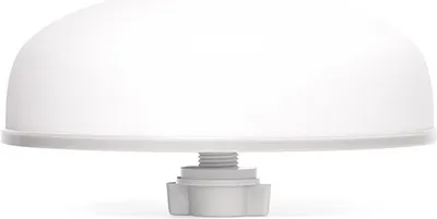 A close-up of a white dome-shaped object with a threaded base.