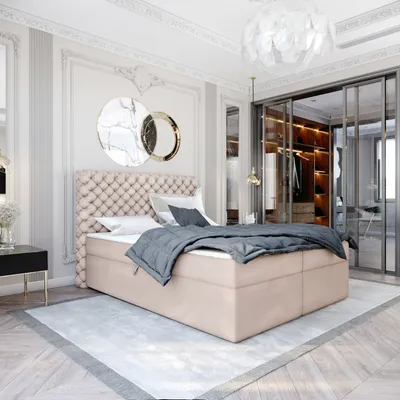 A luxurious bedroom with a tufted headboard bed, a walk-in closet, and decorative wall art.