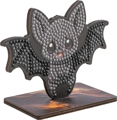 A diamond painting craft kit of a bat on a stand.