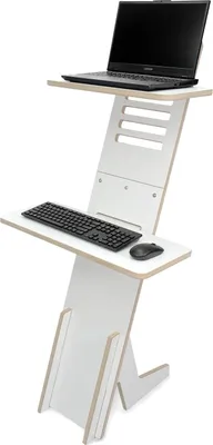 A white standing desk with a laptop, keyboard, and mouse on it.