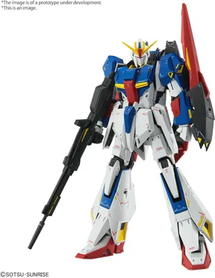 A detailed studio shot of a white, blue, red, and black robot model with a large red fin on its back and a black rifle in its left hand, set against a plain white background.