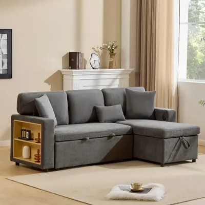 A gray sectional sofa with storage and a built-in shelf is shown in a living room setting.