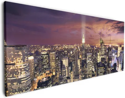 Produktbild von Wallario Premium Leinwandbild New York bei Nacht - Panoramablick über die Stadt in Größe 80 x 200 cm