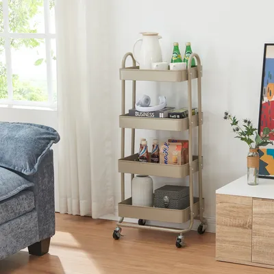 A multi-tiered rolling cart filled with various items, placed next to a sofa and a cabinet in a well-lit room.