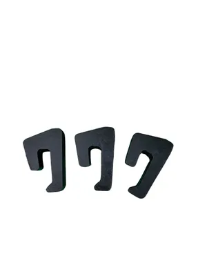 Three black, U-shaped spacers are arranged in a row against a white background.