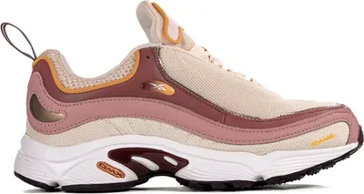 A side view of a single Reebok Daytona DMX sneaker against a white background.