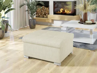 A living room scene with a fireplace, plants, and furniture.