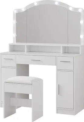 A white vanity table with a tri-fold mirror and LED lights, along with a matching stool, is shown against a white background.