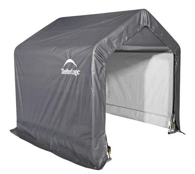 A gray ShelterLogic tent garage or storage shed.