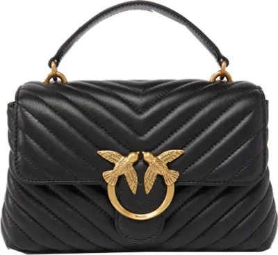 A black quilted leather handbag with gold bird clasp.