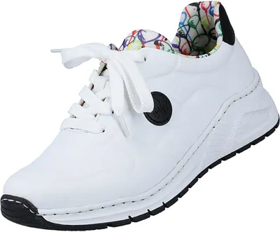 A white sneaker with a colorful patterned interior.