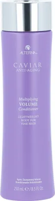 A product shot of a purple bottle of Alterna Caviar Multiplying Volume Conditioner against a white background.