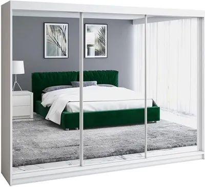 A bedroom scene reflected in a wardrobe with mirrored doors.