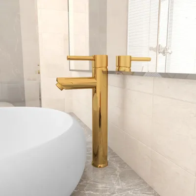 A golden bathroom faucet is shown next to a white sink.
