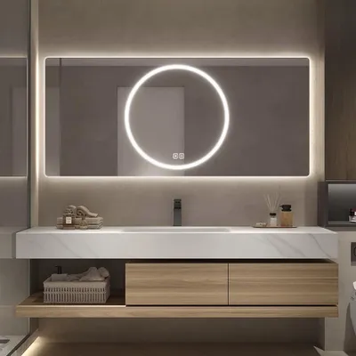 A modern bathroom vanity with a sink, mirror, and storage.