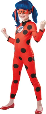 A young girl wearing a Ladybug costume.