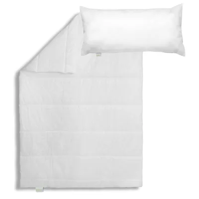 A white duvet and pillow are laid out on a white background.