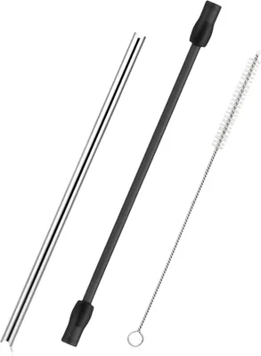 A set of stainless steel milk tubes and a cleaning brush for coffee machines.