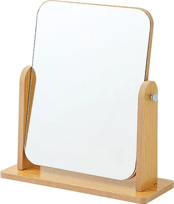 A close-up studio shot of a wooden tabletop mirror.