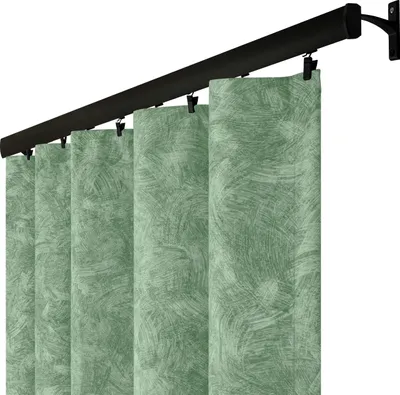 A close-up view of vertical blinds hanging from a dark curtain rod.