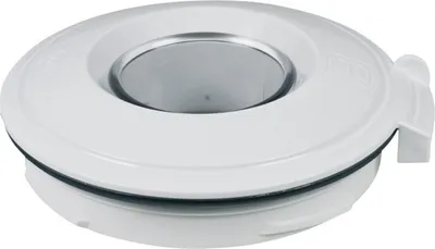 A close-up, slightly angled view of a white lid with a grey circular opening in the center.