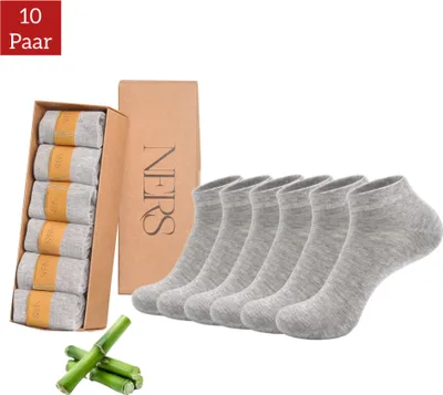 A set of gray ankle socks in a box, along with a separate box of socks and bamboo stalks.