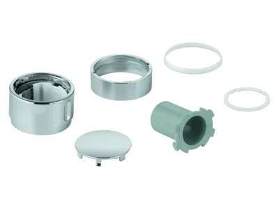 A collection of plumbing parts, including a chrome knob, a chrome ring, a white ring, a gray plastic piece, and a chrome cap, arranged on a white background.