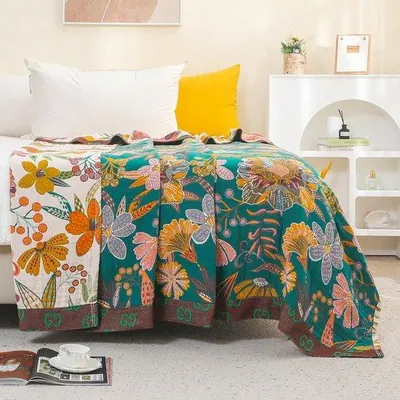 Produktbild von Unyqoos® 100% Baumwolle Bettüberwurf & Boho-Decke, beidseitig weiß/grün, gestricktes Blumenmuster mit Quasten, leicht & atmungsaktiv, maschinenwaschbar 30 °C