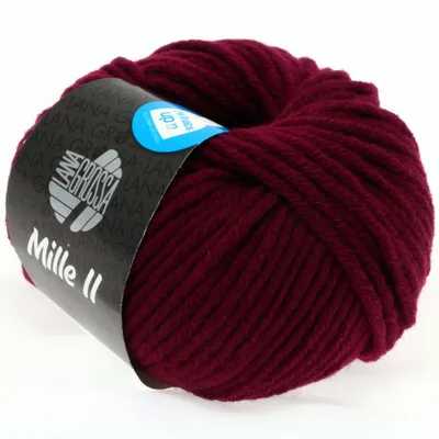 A ball of burgundy yarn with a label wrapped around it.