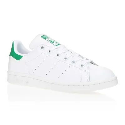 A white Adidas Stan Smith sneaker with green accents is shown against a white background.
