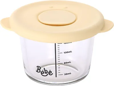 A clear, well-lit studio shot of a baby food container with a yellow lid.
