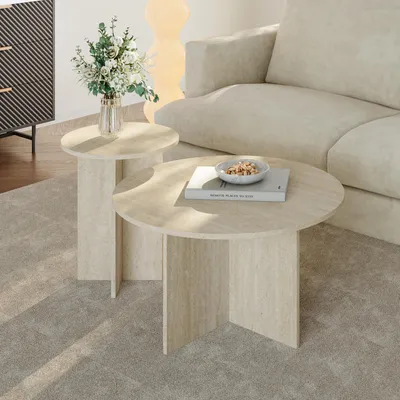 A living room scene with two round coffee tables, a sofa, and a cabinet.